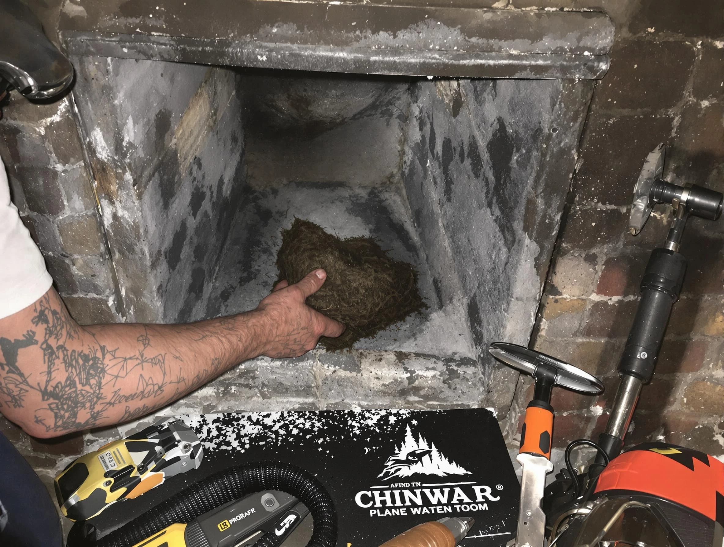 Wellsville Chimney Sweep safely removing debris and screening chimney in Wellsville, UT